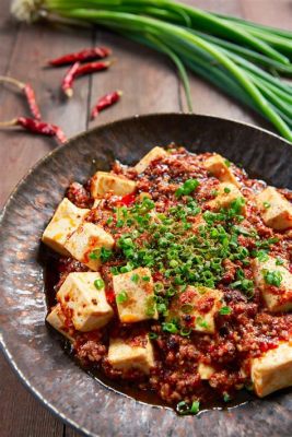  Mapo Tofu: Un piatto piccante e confortante che ti trasporterà nel cuore di Xi'an!